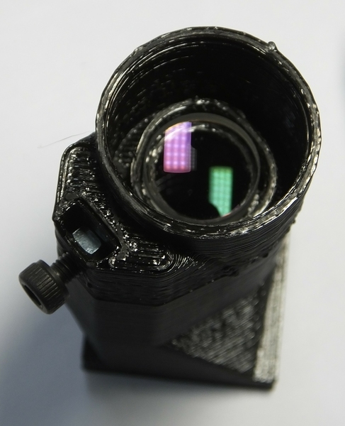 The tube lens, fitted into the optics module